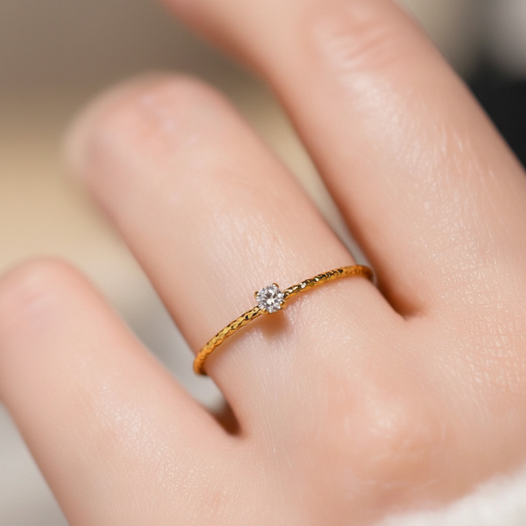 Dainty Gold Solitaire Crystal Ring worn on finger